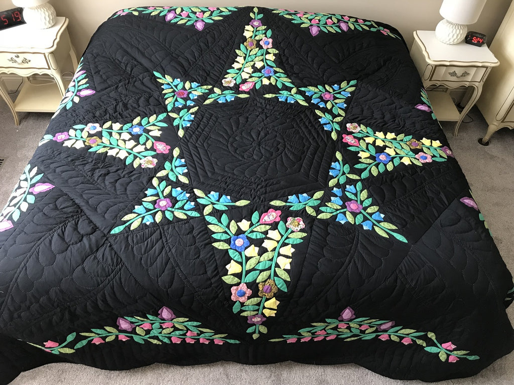 Black Amish Quilt with a Stunning Flower Star Pattern
