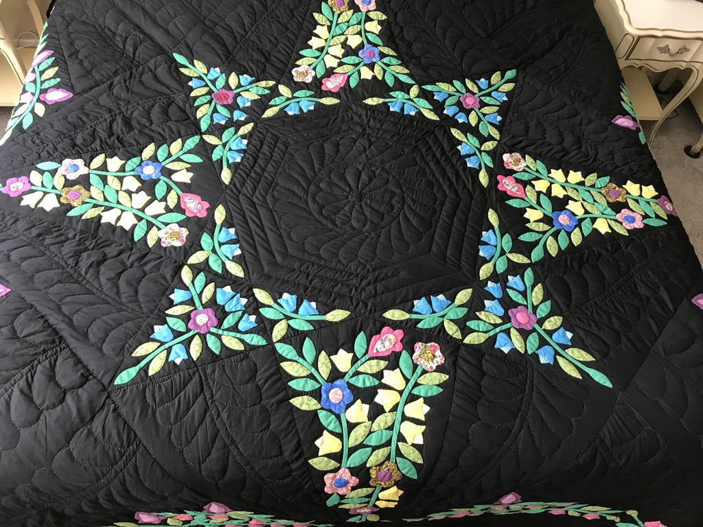 Black Amish Quilt with a Stunning Flower Star Pattern