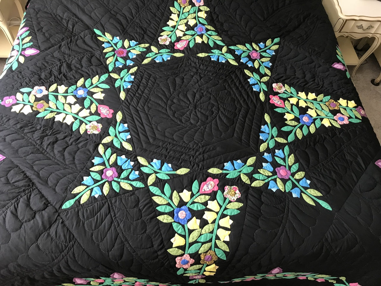 Black Amish Quilt with a Stunning Flower Star Pattern