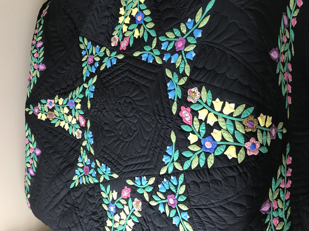 Black Amish Quilt with a Stunning Flower Star Pattern